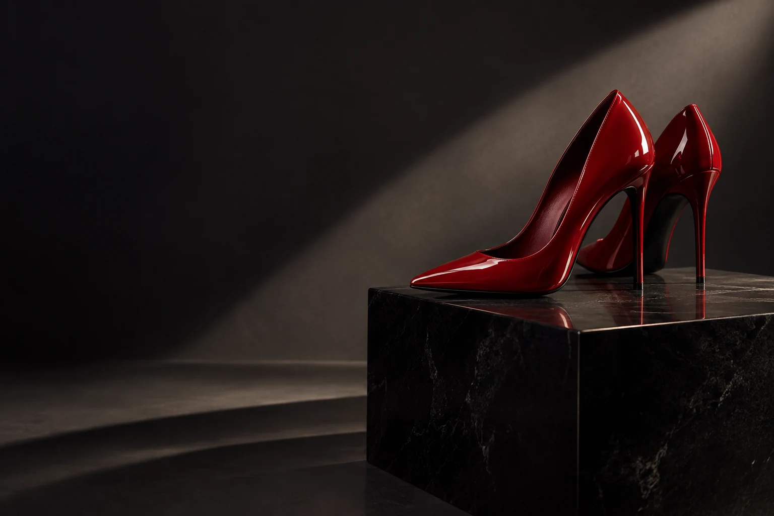 Editorial inspiration: sculptural red pointed heels in a dramatic studio setting